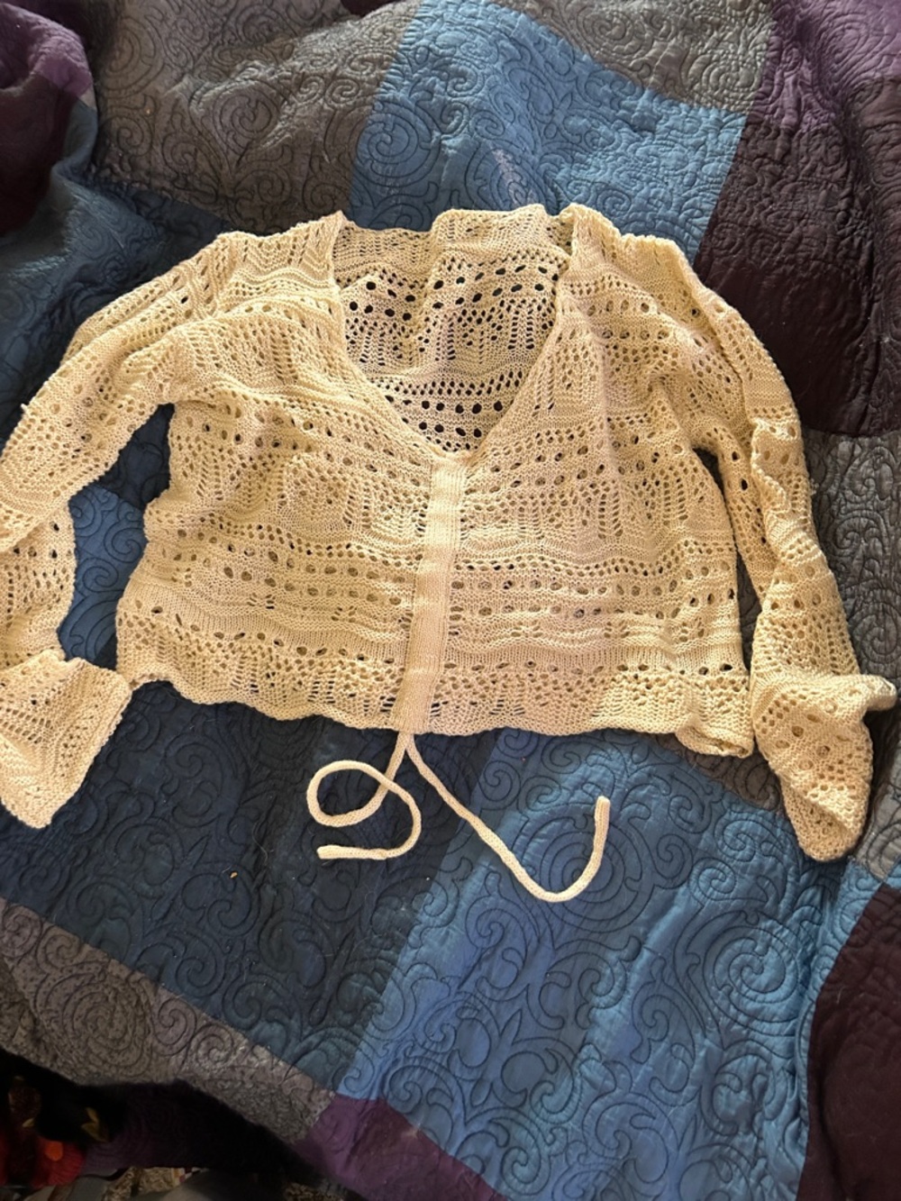 Crocheted sweeter with snitch pull front tie/one size